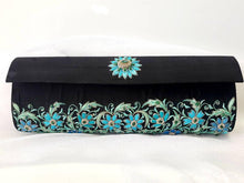Load image into Gallery viewer, Luxury black silk clutch bag embroidered with turquoise blue flowers and embellished with genuine emeralds, zardozi purse. 
