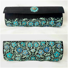 Load image into Gallery viewer, Designer black silk clutch bag embroidered with turquoise blue flowers and embellished with emeralds, front and rear view.
