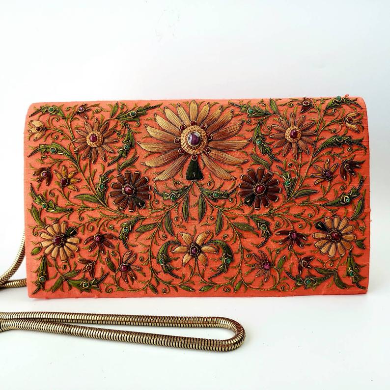 Orange silk clutch bag embroidered with brown flowers and embellished with star rubies, zardozi purse. 