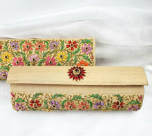 Load image into Gallery viewer, Pale gold silk clutch embroidered with multicolor silk flowers and embellished with star rubies, zardozi purse, front and back view.
