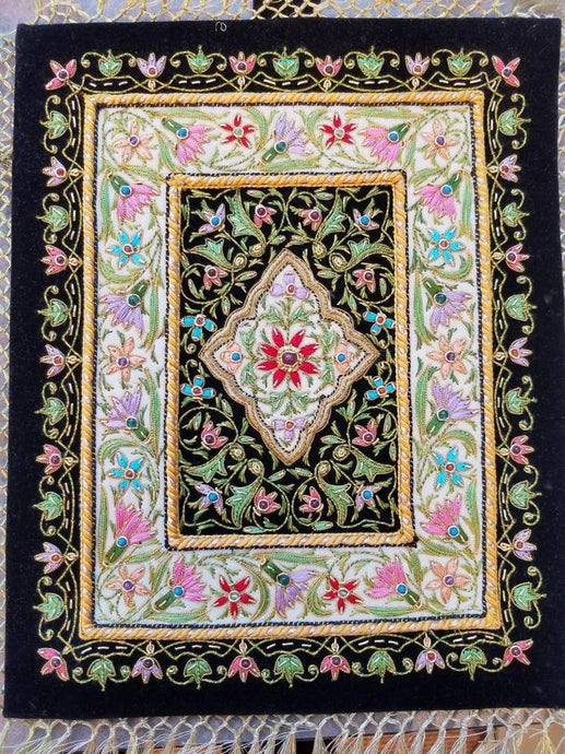 Small silk embroidered floral tapestry, multicolor silk flowers embroidered on black velvet in a carpet pattern, zardozi carpet tapestry.