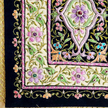 Load image into Gallery viewer, Embroidered lavender purple silk jewel carpet wall hanging in floral pattern, embroidered purple and pink flowers on black velvet tapestry, zardozi tapestry, close up view.

