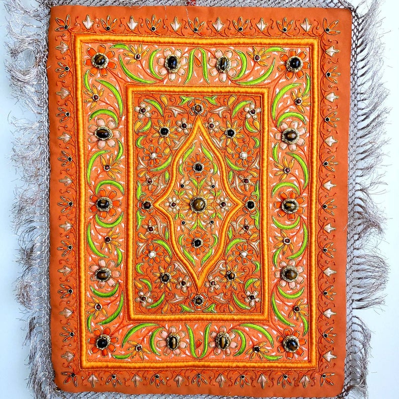 Embroidered jewel carpet wall hanging in orange floral pattern and tiger eye stones, embroidered orange silk flowers on orange velvet, zardozi tapestry. 