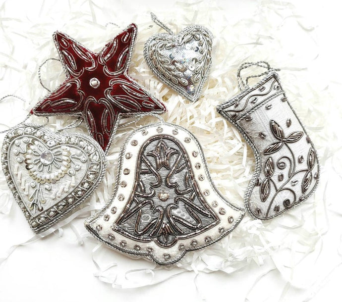 Set of 5 silver and burgundy holiday ornaments, including star, two hearts, bell and Christmas stocking. 